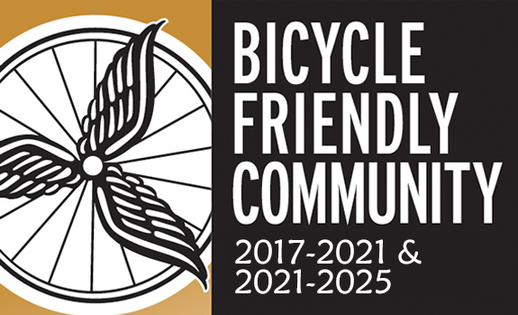 Image includes the League of American Bicyclists logo and words "Bicycle Friendly Community" with designation dates of 2017 to 2021 and 2021 to 2025